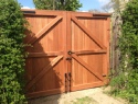 Rear view of sapele hardwood gates, treated brown, rear view