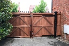 Sapele hardwood gates treated brown, rear view