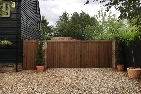 Sapele hardwood gates treated brown, rear view